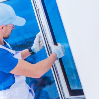 A window technician installing a new window