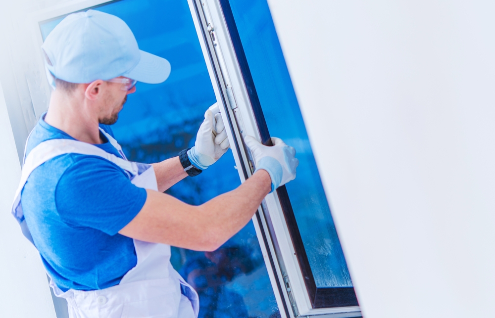 A window technician installing a new window